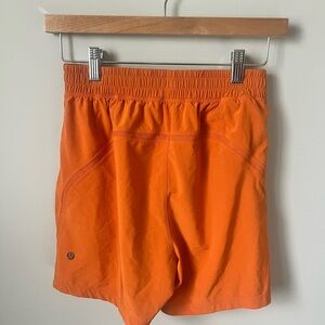 LULULEMON XS men’s athletica Orange Shorts